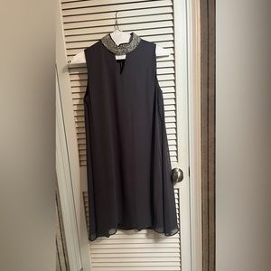 Gray dress with silver embellishment at neck.